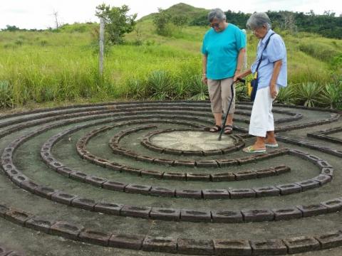Sisters step on to the labyrinth at EcoHOME