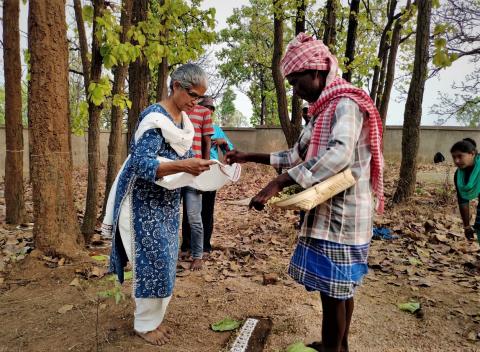 Accepting flowers with gratitude from the Headman of the Santals at the Sacred Grove, Kasiadih 