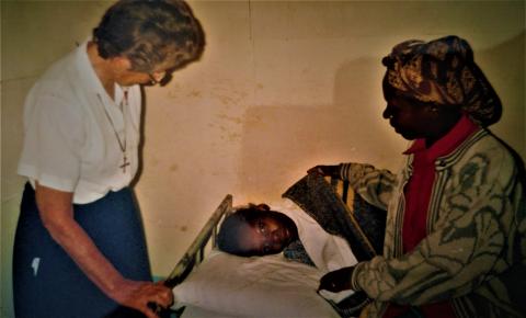 Sister Gill with a patient with HIV/AIDS in Kenya