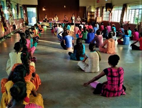 Sister Smita teaches a group of women about their rights