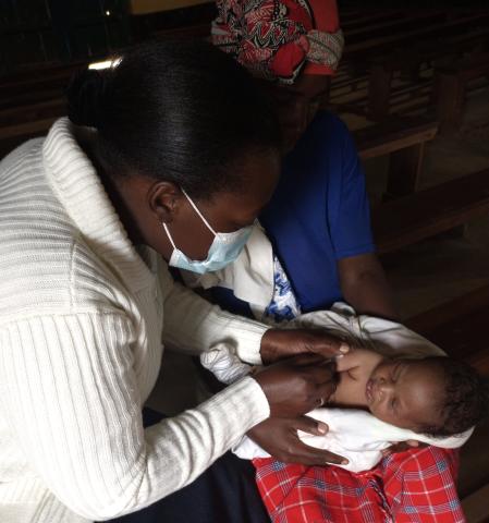 Sister Suzan cares for a newborn
