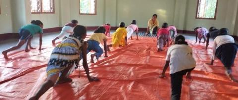 Sister Anita leads a yoga session for teenagers