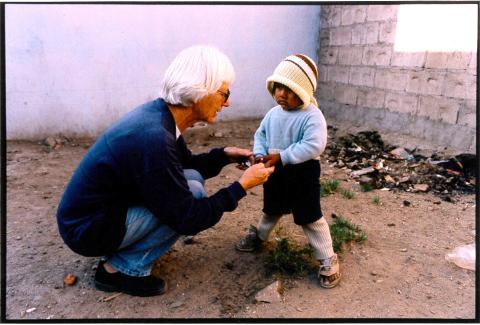 Sister Pat Gootee with a child