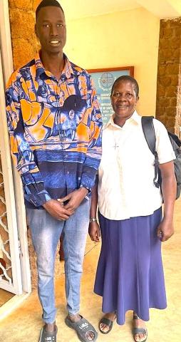 Sister Gaudencia meets the Institute's tallest student