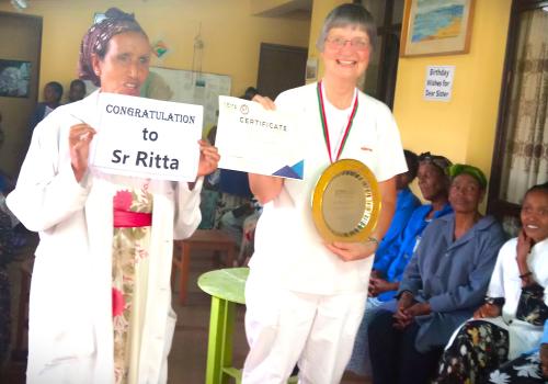 Sister Rita Schiffer receives an award