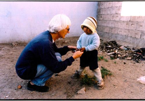 Sister Pat Gootee with a child