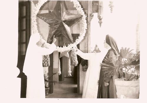 Sr MJ Assumpta shows Mother Dengel the Christmas Star lantern in San Jose, The Philippines, 1963